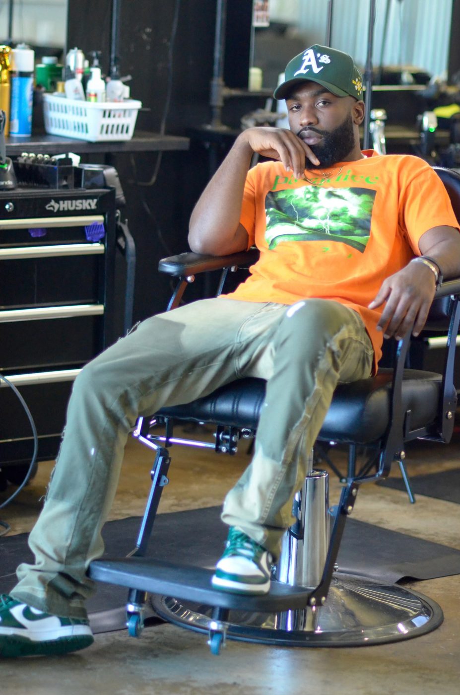 Leondre seated in his barber chair